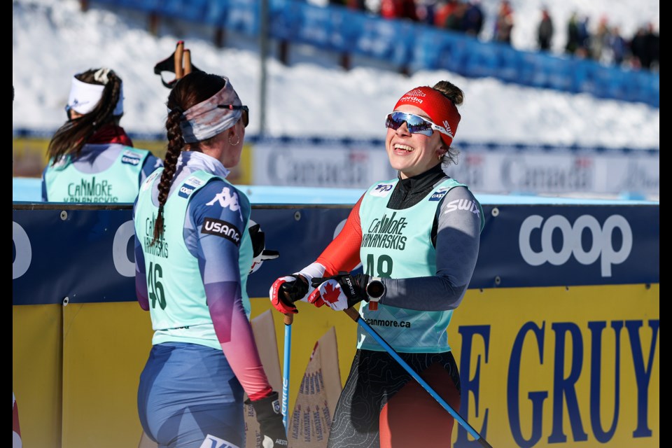 Canmore's Anna Parent is all smiles with USA's Emma Albrecht after the women's 15-km mass start freestyle during the 2024 COOP FIS Cross Country World Cup at the Canmore Nordic Centre on Friday (Feb. 9). JUNGMIN HAM RMO PHOTO 