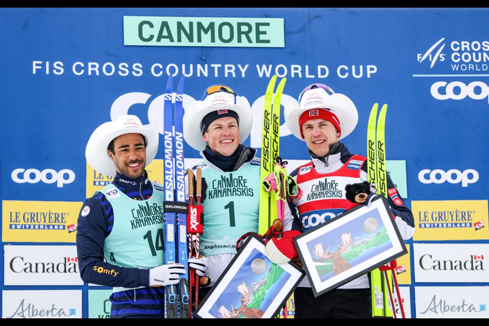 Men's sprint classic winners celebrate on the podium at the 2024 COOP FIS Cross Country World Cup at the Canmore Nordic Centre on Tuesday (Feb. 13). From left: France's Richard Jouve (silver), Norway's Johannes Klaebo (gold), and Norway's Erik Valnes (bronze). JUNGMIN HAM RMO PHOTO
