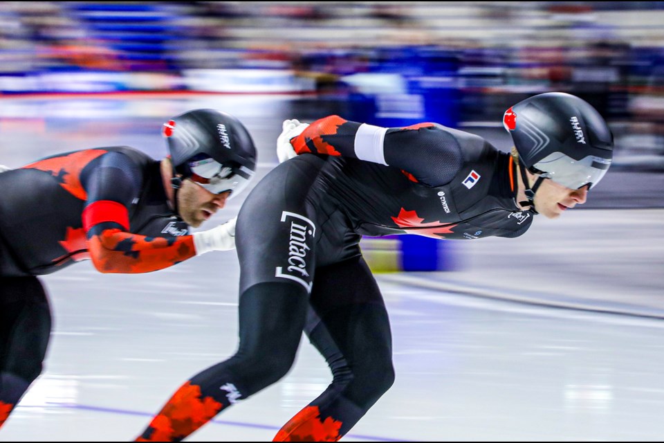 Connor Howe (white), Antoine Gélinas-Beaulieu (red), and Hayden Mayeur (yellow) of Canada skate in the men's team pursuit race at the ISU speed skating World Cup in Calgary on Friday (Feb. 16). The trio won bronze. JUNGMIN HAM RMO PHOTO