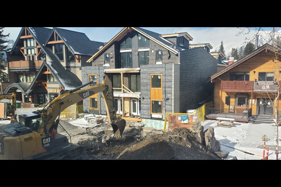 A construction crew works to service a new visitor accommodation building on 10th Street on Tuesday (Feb. 27). GREG COLGAN RMO PHOTO