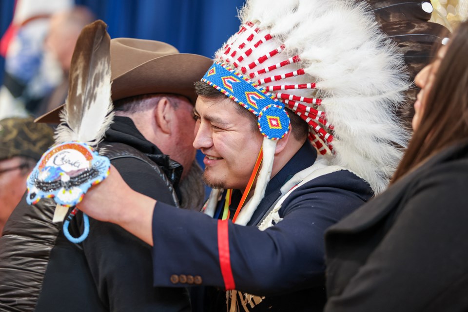 Newly elected Chiniki First Nation councillor Darius Chiniquay greets an elder at the inauguration of Chiniki First Nation chief and council at the Bearspaw Youth Centre in Mînî Thnî (Morley) on Friday (March 8). JUNGMIN HAM RMO PHOTO