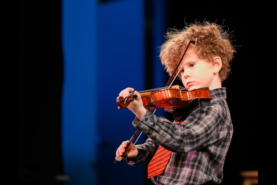 Samson Russel plays "Twinkle Twinkle Little Star" on his violin for the Bow Valley Music Festival Showcase Concert in Canmore at artsPlace on Sunday (March 24).  MATTHEW THOMPSON RMO PHOTO