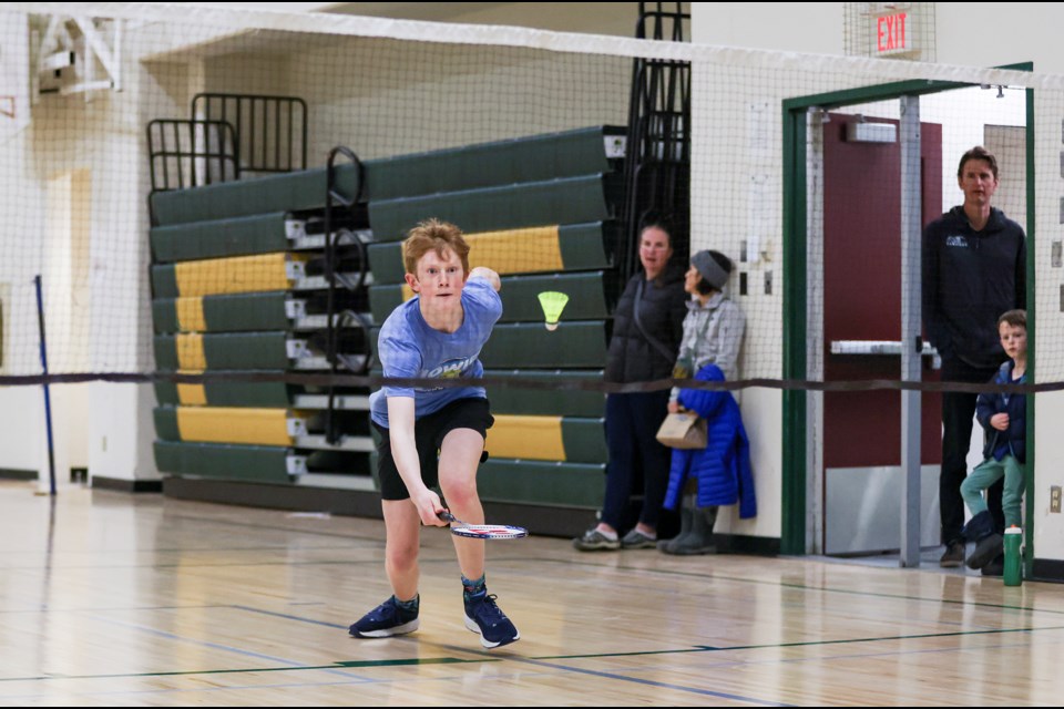 Canmore Collegiate High School's Carson Mckendrick lunges to receive a drop shot during the friendly badminton pre-season competition between Banff and Canmore at Canmore Collegiate High School on Wednesday (March 27). JUNGMIN HAM RMO PHOTO 