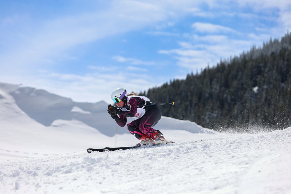 Taylor Sawadsky gets low skiing downhill at the 56th Annual Bruno Engler Memorial ski race, the longest consecutively running annual ski race in Canadian history, at Mount Norquay in Banff National Park on Saturday (April 6). JUNGMIN HAM RMO PHOTO

