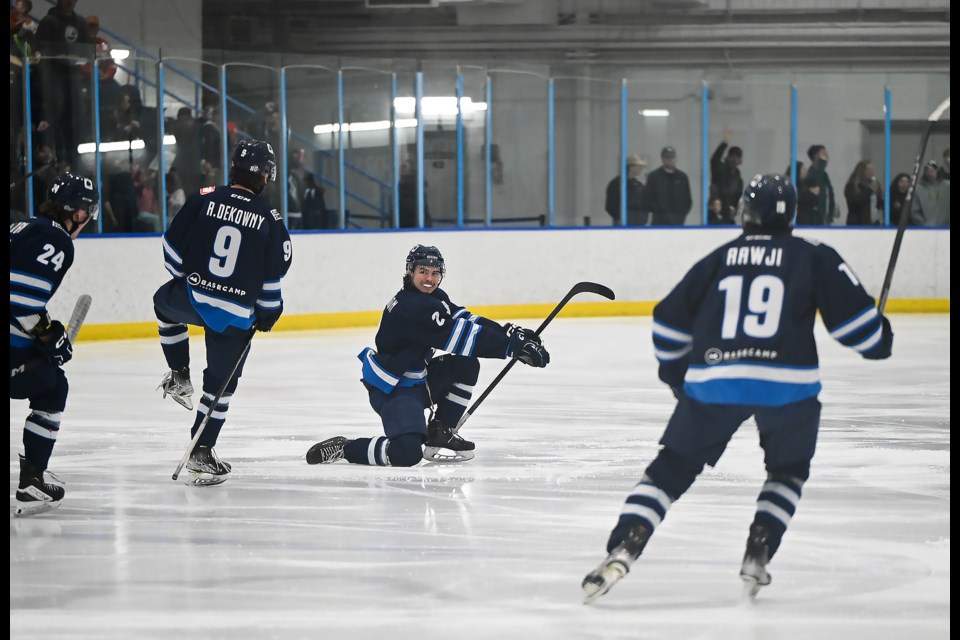 Emanuel Hudson, center, celebrates his goal 10 seconds into Game 6 against the Whitecourt Wolverines in Canmore on Sunday (April 7). The Eagles won 2-0 against the Wolverines. The series is now tied at 3-3. MATTHEW THOMPSON RMO PHOTO