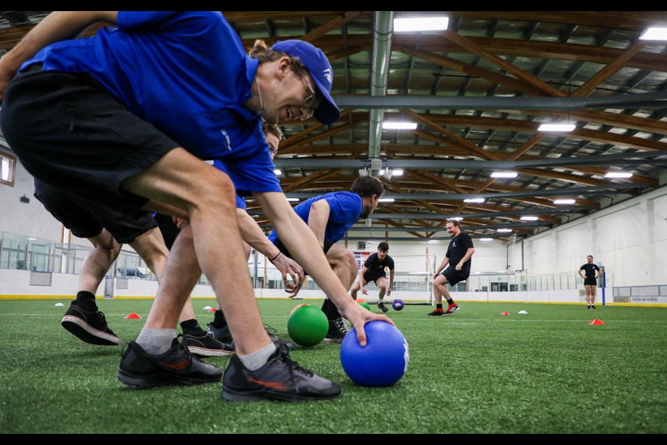 Players rush toward the center line to grab balls during the BanffLIFE's second annual Dodgeball Classic at the Fenlands Banff Recreation Centre on Thursday (April 11).  JUNGMIN HAM RMO PHOTO

