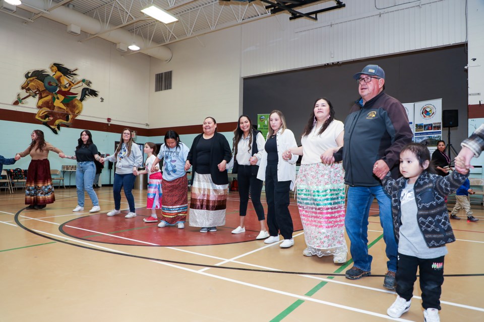 Îyârhe (Stoney) Nakoda First Nation residents and guests dance during the 5th annual Honouring Our Youth Round Dance at Mînî Thnî Gymnasium on Friday (April 19). JUNGMIN HAM RMO PHOTO