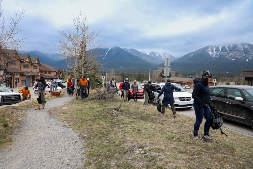 About 40 people participate in Rocky Mountain Soap Company's annual Earth Month community trail clean-up at Bow Meadows Crescent in Canmore on Friday (April 26). JUNGMIN HAM RMO PHOTO
