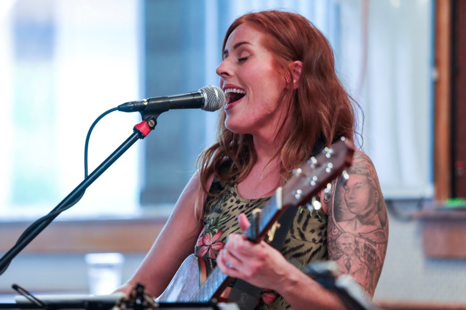 Caitlin Connelly pours her heart into a song during the Poetry and Pints at the Banff Legion on Friday (July 19). JUNGMIN HAM RMO PHOTO


