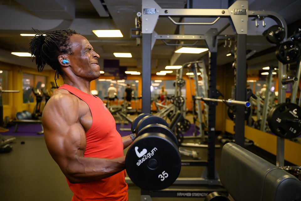 Andy Mabidi pumps iron at Anytime Fitness in Canmore on Thursday (July 25). MATTHEW THOMPSON RMO PHOTO