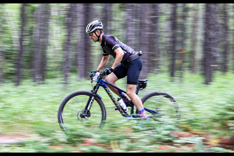 Thomas Lane of Edmonton rides fast during the 24-hour mountain bike race Canadian Rockies 24 at the Canmore Nordic Centre on Saturday (July 27). JUNGMIN HAM RMO PHOTO 