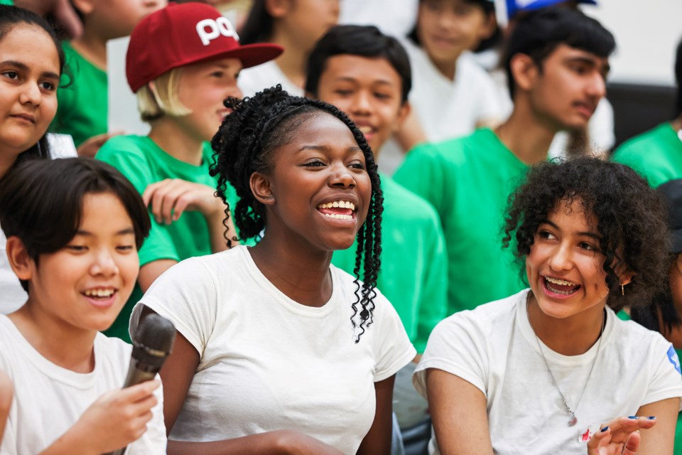 Makaylia Hinds, centre, Sakuya Ichikawa, left, and Victoria Castillo Matamoros sing together during the graduation ceremony for the NOW Program at Banff Community High School on Friday (Aug. 16).  JUNGMIN HAM RMO PHOTO
