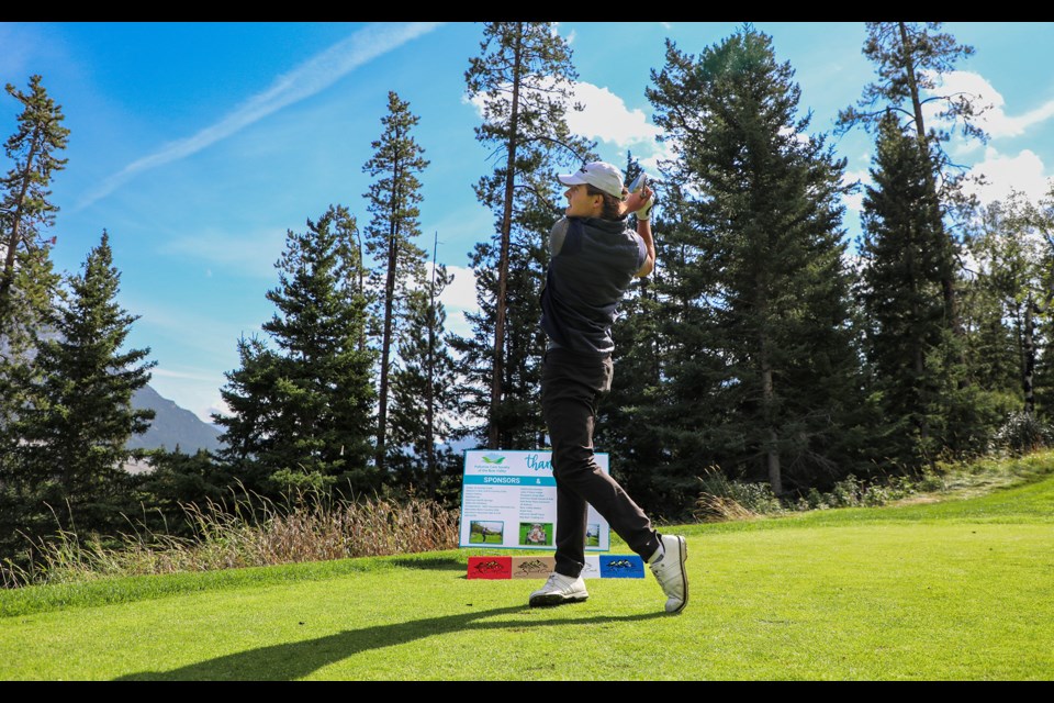 Tom Sluka watches his drive at the sixth annual fundraiser Golf for Hospice event hosted by the Palliative Care Society of the Bow Valley (PCSBV) at Stewart Creek Golf & Country Club in Canmore on Thursday (Aug. 22). JUNGMIN HAM RMO PHOTO 
