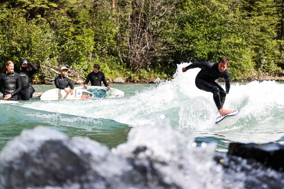 David Manning rides a chilly river wave in the Mountain Wave Classic annual surf competition in Kananaskis Country on Saturday (Aug. 24). JUNGMIN HAM RMO PHOTO 