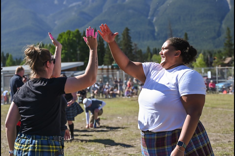 Alexis Johnson gets high fives from all the competitors after setting a Canadian record of 45 feet and five inches at the Heavy Games competition at the 33rd Canmore Highland Games on Sunday (Sept. 1). MATTHEW THOMPSON RMO PHOTO