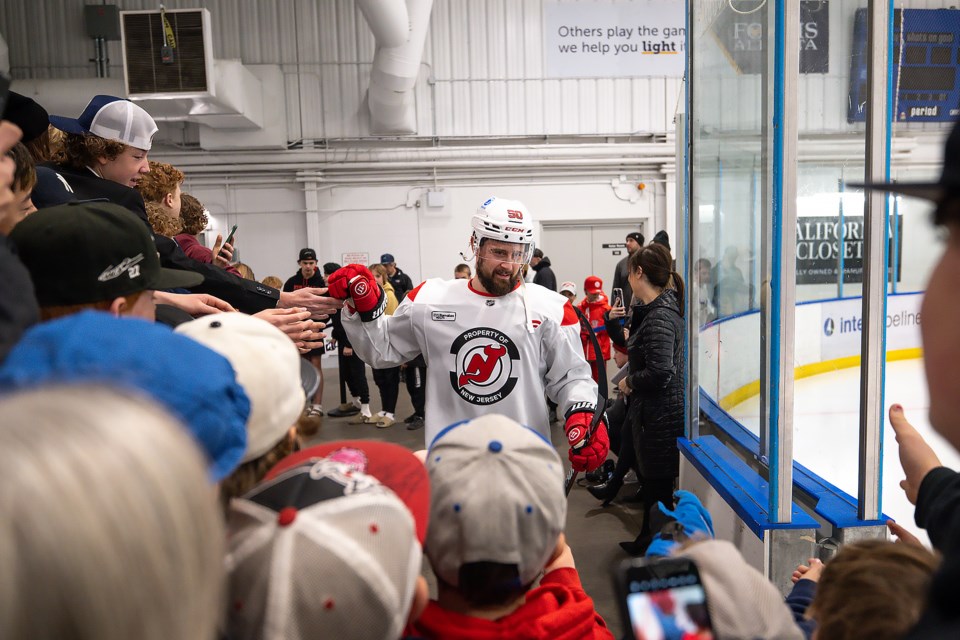 PHOTOS Fans watch NHL s New Jersey Devils practice in Canmore Alberta Bow Valley News