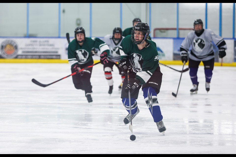 Team Vixens’ Jennifer Sisson looks to pass during the showcase game on Tuesday (Jan. 14) at the Canmore Recreation Centre.  JUNGMIN HAM RMO PHOTO