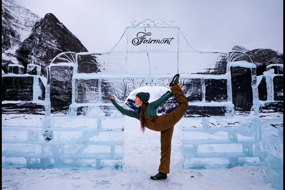 Noah Reanna Sorenson from Yukon Territory shows off her flexibility in front of the ice castle at Lake Louise on Thursday (Jan. 30). JUNGMIN HAM RMO PHOTO