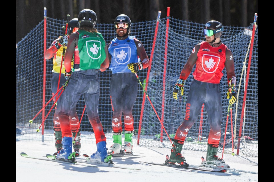 Canmore's Kris Mahler, blue, celebrates with his colleagues after crossing the finish line in the final race during the men's ski cross Canadian national championships at Nakiska Ski Area in Kananaskis Country on Saturday (April 5). JUNGMIN HAM RMO PHOTO 