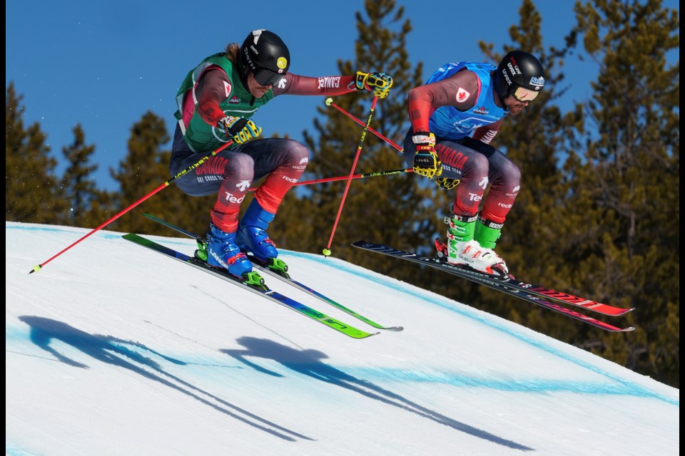 Jared Schmidt, left, and Canmore’s Kris Mahler fly over a jump during the Canadian Ski Cross Nationals at Nakiska Ski Resort on Saturday (April 5). Schmidt placed second in the men’s category while Mahler took home a third place finish. LEAH PELLETIER RMO PHOTO