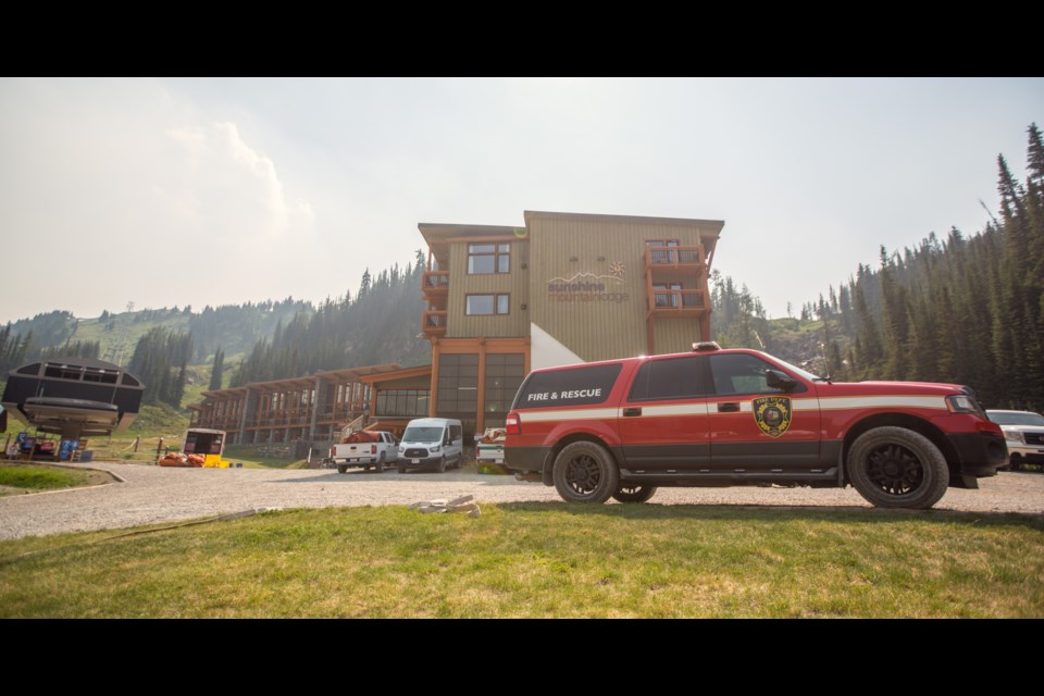 Parks Canada and Banff Fire Department members put out sprinklers and hose at Sunshine Village in July 2017. Canmore and Banff are applying for a provincial grant to set up a regional emergency management plan