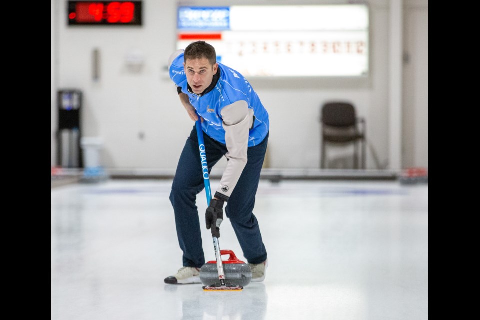 Olympic champion John Morris sweeps a rock into the house during the first match of the 2020 Qualico Mixed Doubles Classic at the Canmore Golf and Curling Club on Jan. 2, 2020. EVAN BUHLER RMO PHOTO