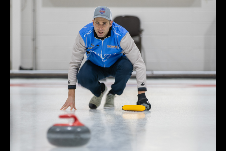 Two-time Olympic champion John Morris watches his rock as it enters the house during a match at the 2020 Qualico Mixed Doubles Classic at the Canmore Golf and Curling Club. RMO FILE PHOTO