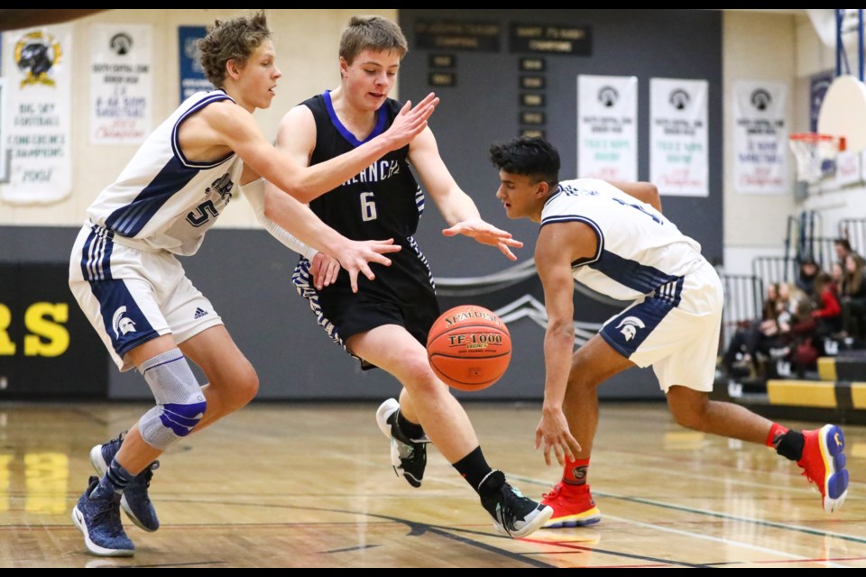 OLS Avalanche forward Justin Hughes drives to the hoop against the Strathcona-Tweedsmuir Spartans on Friday (Jan. 31) in Banff. EVAN BUHLER RMO PHOTO