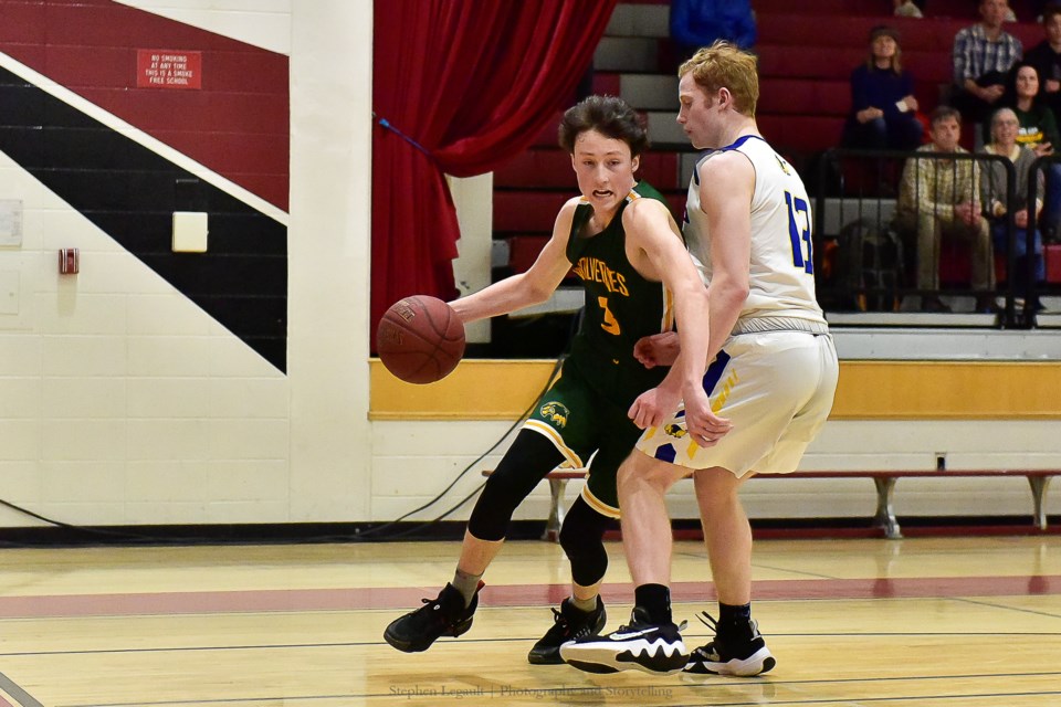 Canmore Wolverines guard Jaxon Fisher drives the ball to the hoop against the Brooks Buffalos at the 2022 South Central Zones tournament. STEPHEN LEGAULT PHOTO