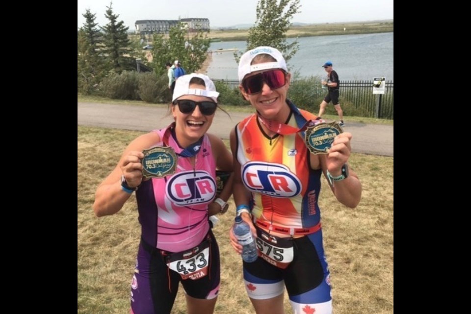 Olivia Driedger, left, and Amber Wanless pose after competing in the Ironman 70.3 Calgary triathlon on Sunday (Aug. 1). SUBMITTED PHOTO