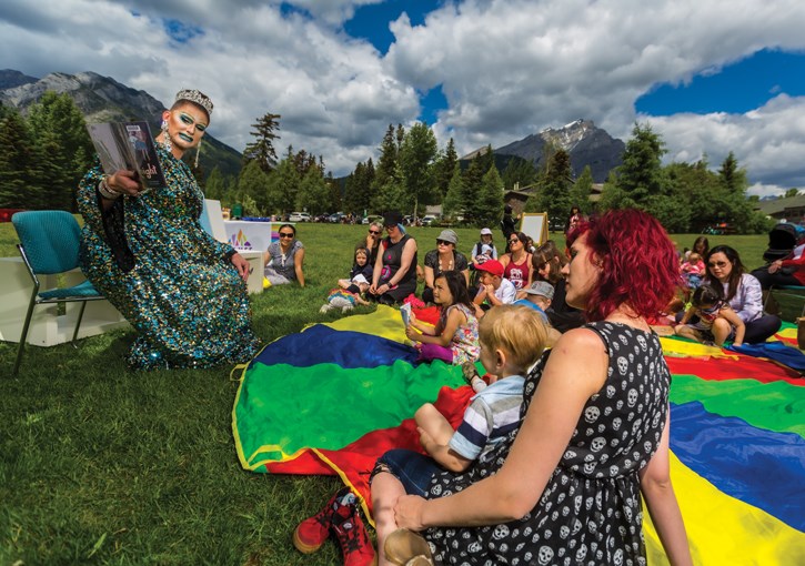 Drag queen Slamda reads stories and sings songs with children and adults alike during the Banff Public Library's Reading With Royalty event celebrating Pride Month at Central Park in Canmore on Sunday (June 30). This year marks the 50th anniversary of the birth of the modern Pride movement, following the Stonewall Riots in New York City in 1969. ARYN TOOMBS RMO FILES