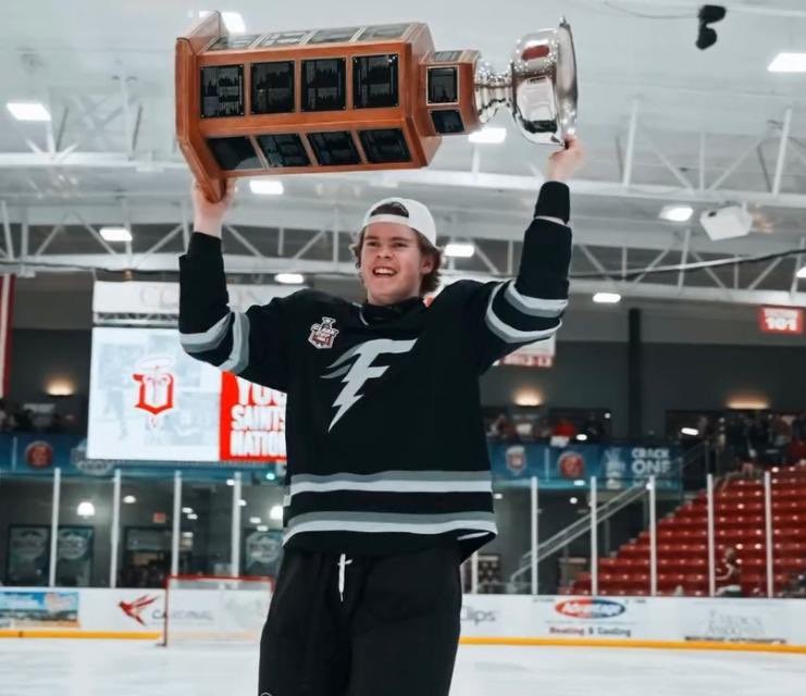 Fargo Force defenceman Finn McLaughlin hoists the Clark Cup. FARGO FORCE PHOTO