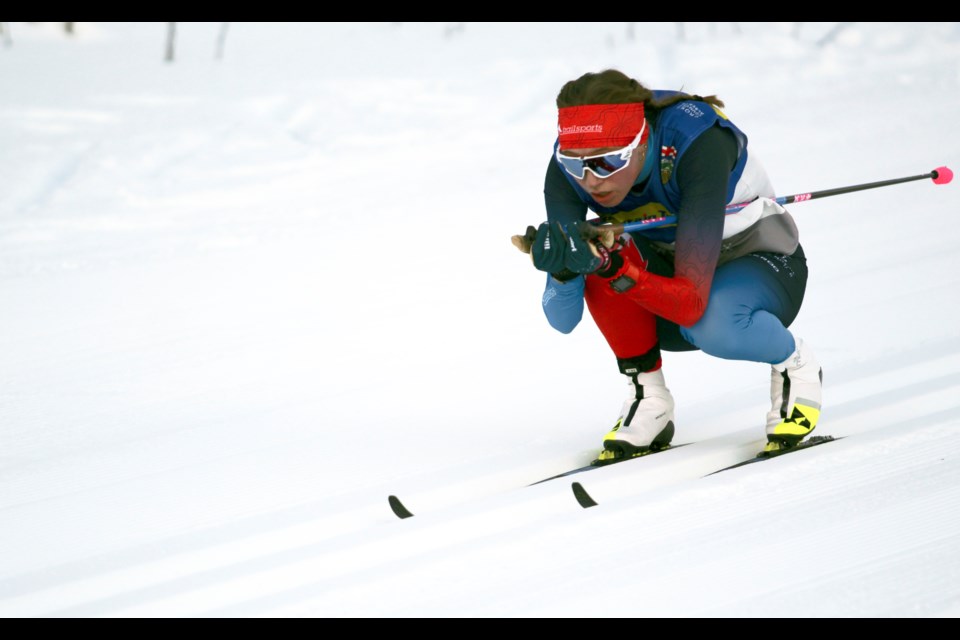 Team Great Britain's and Canmore-raised skier Tabitha Williams gets low skiing downhill, putting all her weight on the centre of her skis to gain as much speed as possible during Sunday's (Jan. 8) mass start classic in Canmore at the Alberta Cup. JORDAN SMALL RMO PHOTO