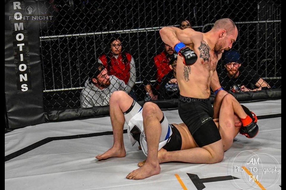 Adam Zekry ground and pounds Derek Khosa at Saturday’s (Jan. 25) Fight Night 12 in Lethbridge, Alta. ANETT MESZAROS FIGHT NIGHT PHOTO