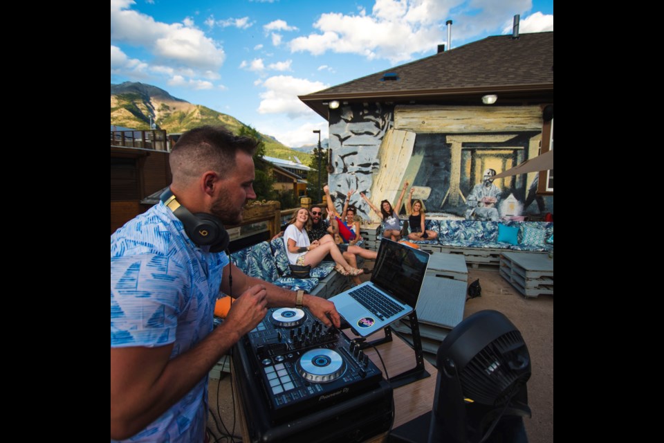 Andre Hall, with Just Send it DJs, plays a set in August at Half Hitch Brewing Company in Canmore. JORDAN HAMES PHOTO