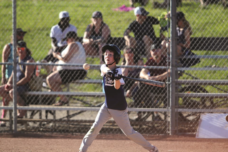 Bow Valley Little League batter Leif Butchenschon looks to slug one out of the park on Monday (June 21).