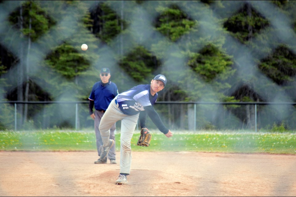 Bow Valley Blues pitcher Matt Arsenault throws a strike during Sunday's (June 12) game against Calgary North 2 at Millennium Park in Canmore. JORDAN SMALL RMO PHOTO