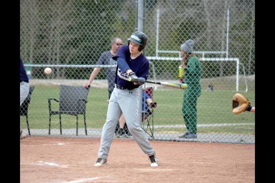 Bow Valley Blues batter Nathan Adam of the senior team swings for the fences on Sunday (May 15) at Millennium ball park in Canmore. The Blues won 16-5 over the Centennial Diamond Backs. JORDAN SMALL RMO PHOTO