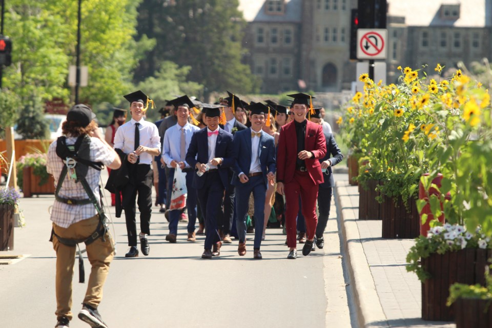 The graduates of Banff Community High School stroll downtown on Tuesday (June 29) for photos and celebrating the end of one chapter and beginning of another. JORDAN SMALL RMO PHOTO