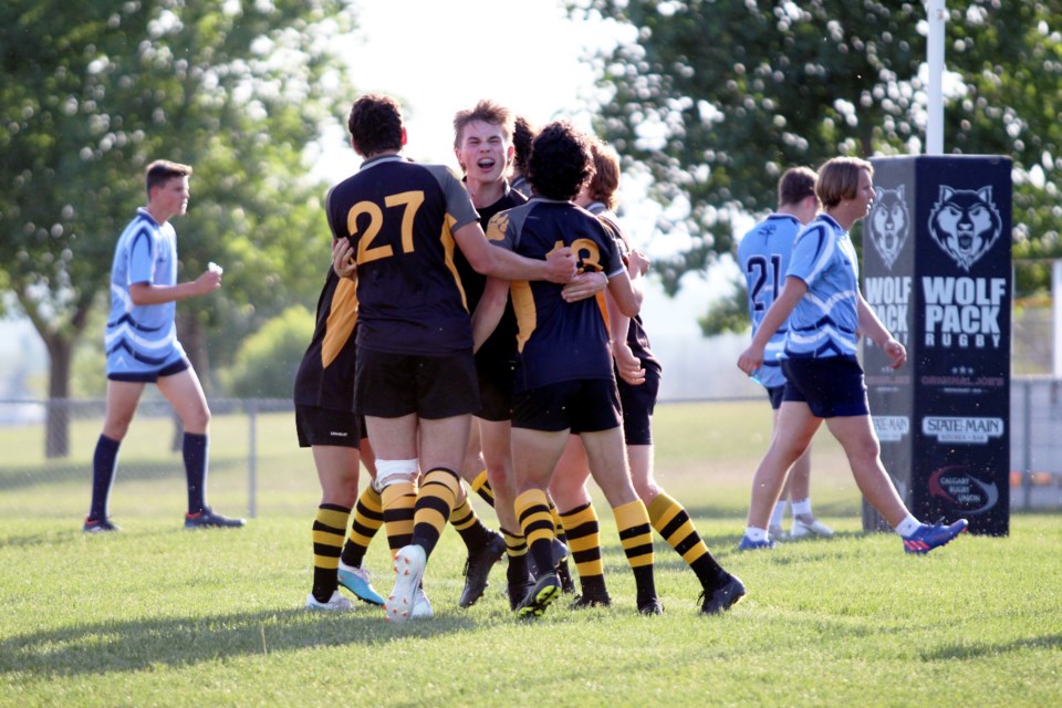 Bears' Cam Geyer celebrates a try with the team against the Strathcona-Tweedsmuir Spartans at the 2023 zones final on Monday (June 5) at Calgary Rugby Union. The Bears won 43-17. JORDAN SMALL RMO PHOTO
