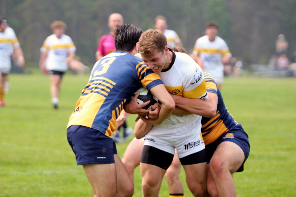 Banff Bears Matt Lavigne bites down and fights through two defenders during a match against the Bow Valley Grizzlies on July 15 at Banff Recreation Grounds. JORDAN SMALL RMO FILE PHOTO