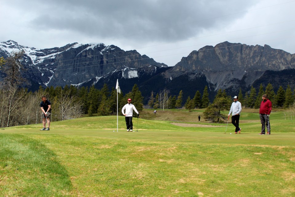 Golfers Mitch Narver, left, Kris Lowes, Jared Asmussen and Shane Peet were among the first to hit the fairways when courses opened in Alberta last week. On Saturday (May 9), the four played at Brewster's Kananaskis Ranch Golf Course, which is the first local course to open its doors this season. JORDAN SMALL RMO PHOTO