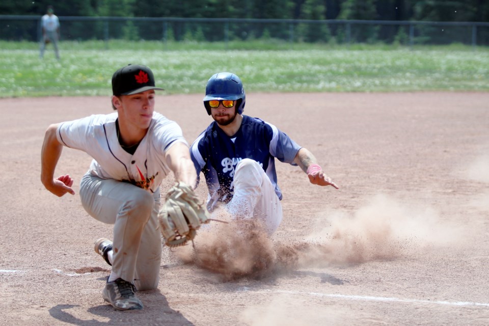Bow Valley Blues catcher Logan Carruthers slides into third base against Calgary North 3 in the team's last home game of the regular season on June (June 11) at Canmore's Millennium Park. JORDAN SMALL RMO PHOTO