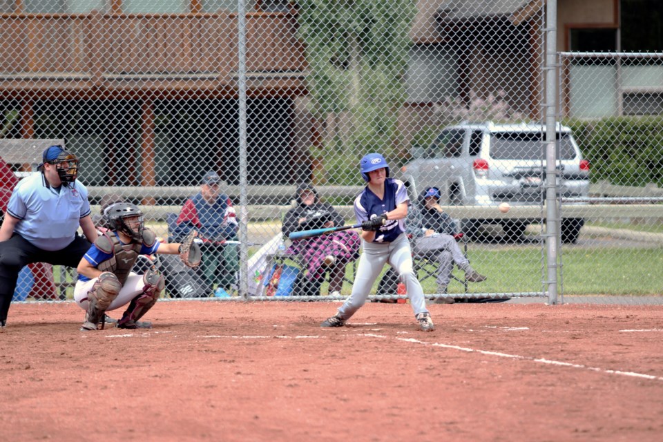 Bow Valley Blues' Teagan Young looks to muscle fastball out of the park during a do-or-die playoff game against Calgary North 1 on Sunday (June 18) at Canmore's Millennium Park. JORDAN SMALL RMO PHOTO