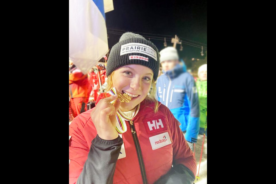 Britt Richardson bites down on the gold medal she won at the 2024 Junior World Ski Championships. SUBMITTED PHOTO