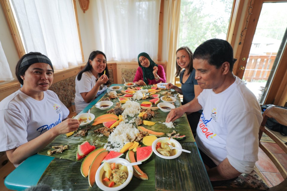 Food Is My Teacher's Dr. Tammara Soma eats a meal with members of local groups the Filipino Organization in the Rocky Mountains and Bow Valley Food Alliance. BRANDY Y PRODUCTIONS INC. PHOTO