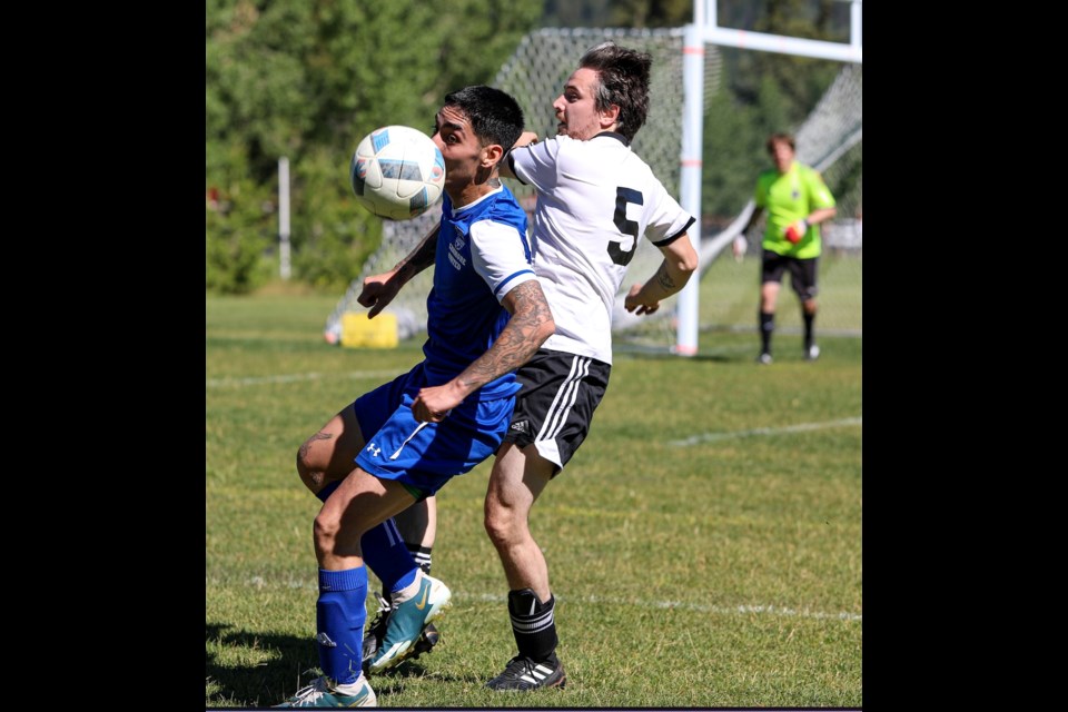 Canmore United's Matias Mardones and Banff Springs FC's Robert Weir fight for the ball during Sunday's (Aug. 7) match-up at Banff rec grounds. 	JUNGMIN HAM RMO PHOTO