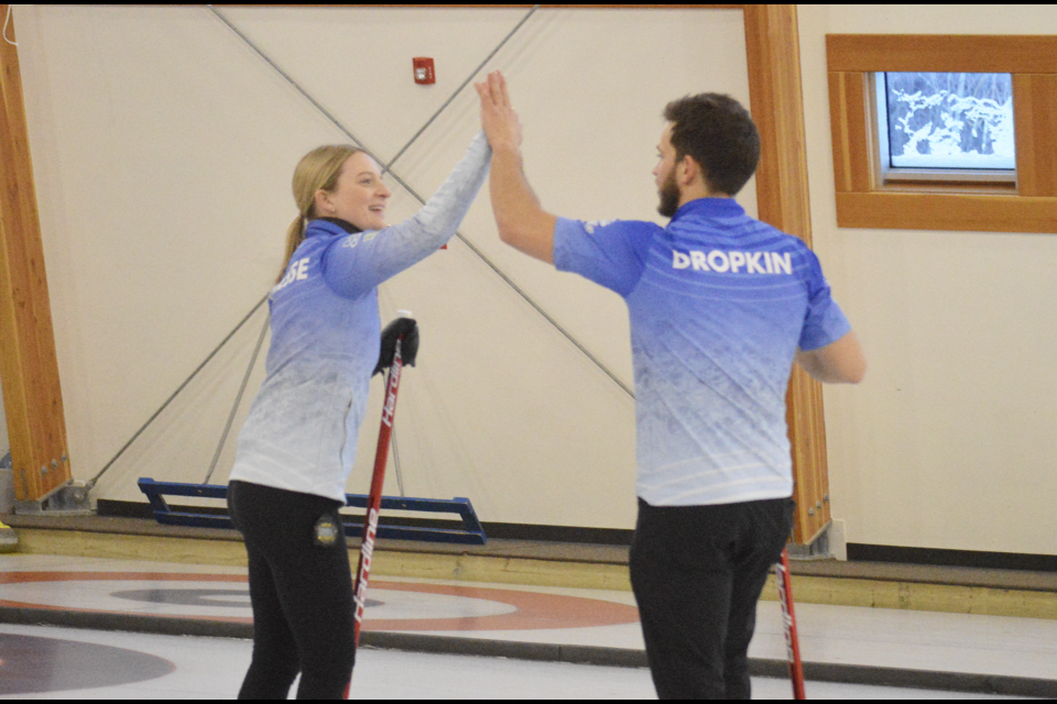 Team Korey and Cory (Korey Dropkin and Cory Thiesse) high-five after winning the finals of the Rocky Mountain Mixed Doubles Classic on Sunday (Jan. 7) at the Fenlands Banff Recreation Centre. JORDAN SMALL RMO PHOTO