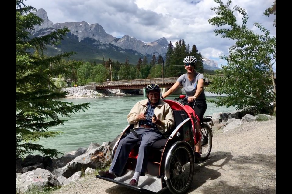 Canmorite Jenn Rowley cycles with senior Mike Mitrovic through the Cycling without Age program, introduced to Canmore four years ago. 
SUBMITTED