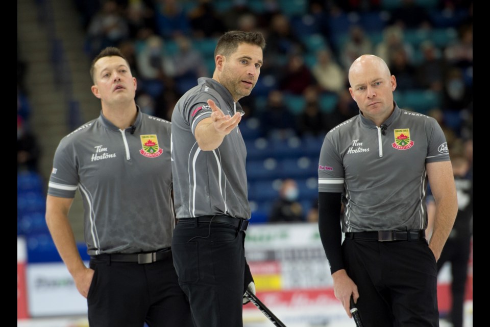 Canmore's John Morris, middle, and Team Kevin Koe teammates Ben Hebert and B.J. Neufeld at the 2021 men's Olympic trials in Saskatoon. MICHAEL BURNS CURLING CANADA PHOTO